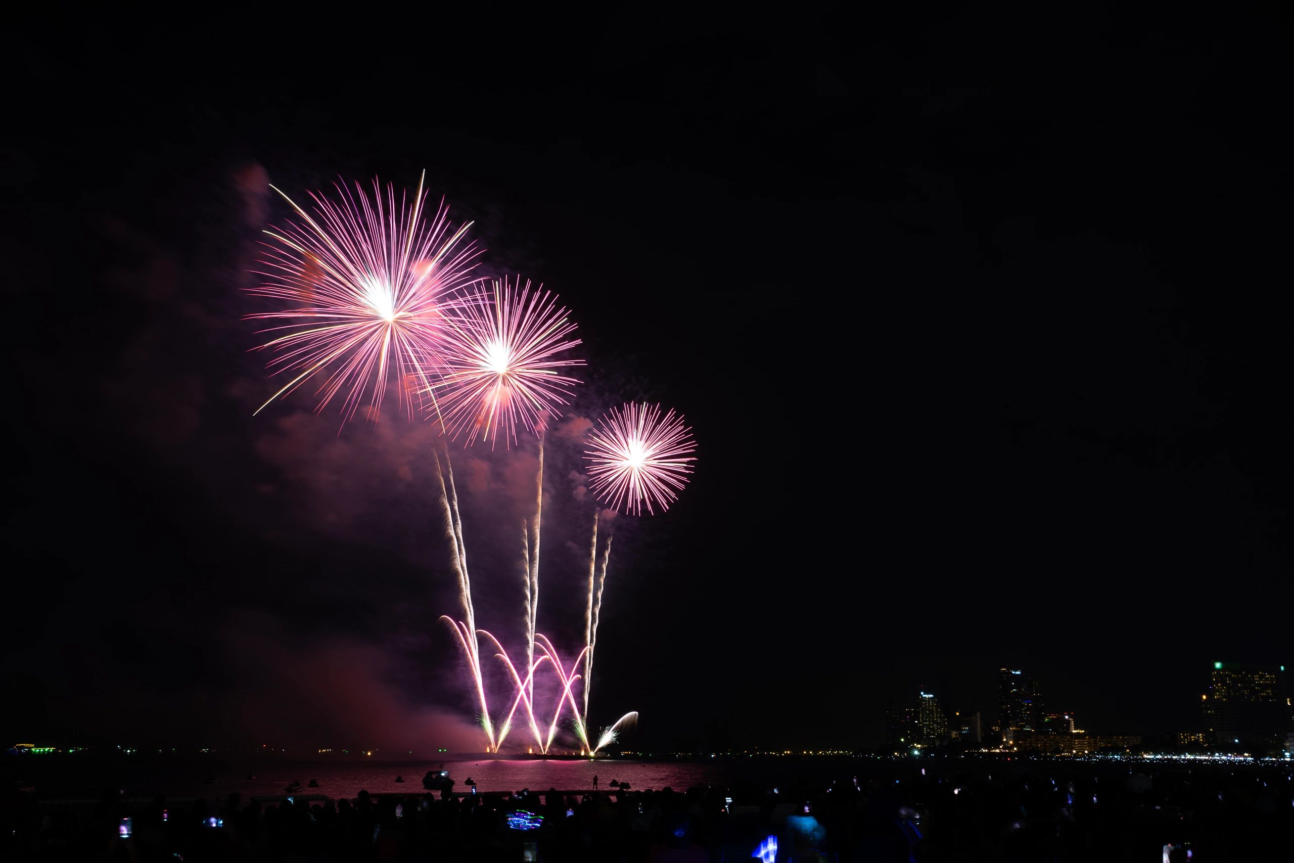 Fireworks lighting up the night sky at a live event